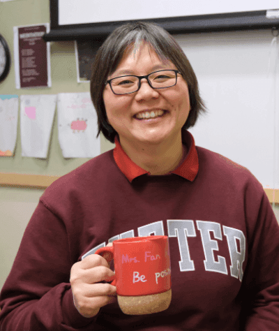 A warm murmur fills the walls of Instructor in Mathematics Fan Huang’s classroom as Exonians assess problems in small groups. Huang moves around the room, listening to her students’ methodical reasoning. In a school where math can be a source of high anxiety, Huang is a constant source of reassurance, giving her students close, individual guidance. 